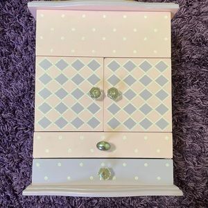 Gently used jewelry box with a lot of storage.